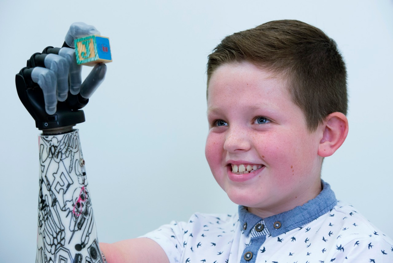 Illustration for article titled Kid Gets Awesome New Bionic Hand, Reminds Us Not Everything is Garbage